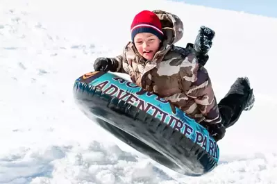 little kid snow tubing at rowdy bear in pigeon forge tn