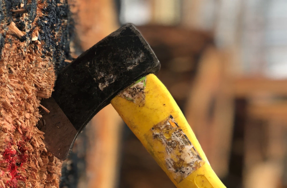 axe in wooden target