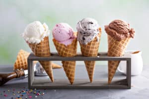 ice cream in waffle cones in a stand