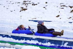 mom and daughter snow tubing in pigeon forge
