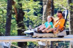 riders on rowdy bear mountain coaster in gatlinburg