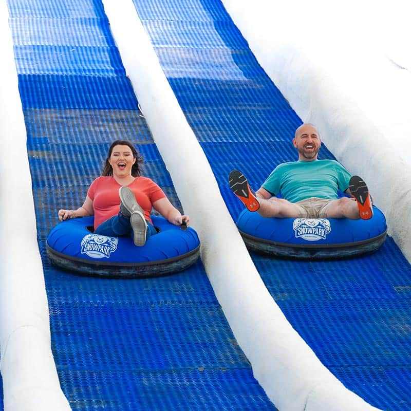 Family riding down Tubing Hill